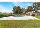 Community pool surrounded by well-manicured grass and plenty of sun at 2261 Tall Pine Dr, Las Vegas, NV 89108