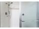 Clean and functional shower with white tile and glass door at 2261 Tall Pine Dr, Las Vegas, NV 89108