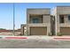 Modern two-story home with a two-car garage and mixed stone and siding facade at 240 White Crest Peak Ave, Henderson, NV 89015