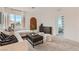 Cozy living room featuring neutral tones, comfortable seating, and views to the bedroom at 240 White Crest Peak Ave, Henderson, NV 89015