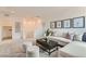 Upstairs living room featuring comfortable seating and modern decor with carpeted floors at 240 White Crest Peak Ave, Henderson, NV 89015