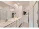 Bright, spacious bathroom features double sinks, a large mirror, and a glass enclosed shower at 242 White Crest Peak Ave, Henderson, NV 89015