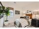 Cozy bedroom with a comfortable bed, stylish decor, and a view of the outside from the window at 242 White Crest Peak Ave, Henderson, NV 89015