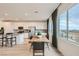 Bright, modern kitchen featuring an island, stainless steel appliances, and large windows at 242 White Crest Peak Ave, Henderson, NV 89015
