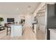 Kitchen with stainless steel appliances, ample cabinetry, and a view into the living area at 242 White Crest Peak Ave, Henderson, NV 89015