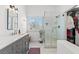 Bathroom with dual sinks, glass-enclosed shower, and neutral color palette at 2513 Aberdeen Ln, Henderson, NV 89014