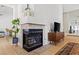 Modern fireplace with decorative accents, a sleek TV console, and stylish living room decor at 2513 Aberdeen Ln, Henderson, NV 89014