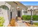 Inviting entryway with a decorative front door, lush greenery, and charming outdoor lighting at 2513 Aberdeen Ln, Henderson, NV 89014