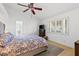 Spacious main bedroom with a ceiling fan, dresser, and natural light from the window at 2513 Aberdeen Ln, Henderson, NV 89014