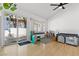 Bright playroom area with a large sliding door, hardwood floors, and fun, colorful decor at 2513 Aberdeen Ln, Henderson, NV 89014