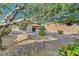 A well-maintained backyard with rock garden, foliage, and gravel throughout the spacious area at 2613 Velodrome Ct, Henderson, NV 89044