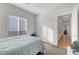 Cozy bedroom featuring a bed, a window, and closet doors for convenient storage at 2613 Velodrome Ct, Henderson, NV 89044