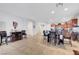 Bright open-concept living area with dining table and chairs at 2613 Velodrome Ct, Henderson, NV 89044