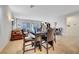 Bright dining area with tile flooring, dining table set, and comfortable seating at 2613 Velodrome Ct, Henderson, NV 89044