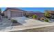 Charming home with a concrete driveway and desert landscaping for easy upkeep at 2613 Velodrome Ct, Henderson, NV 89044