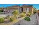Well-maintained desert landscaping adds curb appeal to this beautiful property at 2613 Velodrome Ct, Henderson, NV 89044