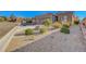 Attractive desert landscaping enhances the beauty of this residential home at 2613 Velodrome Ct, Henderson, NV 89044