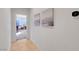 Clean hallway showcasing neutral walls, tile flooring, and inviting doorway at 2613 Velodrome Ct, Henderson, NV 89044