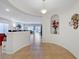 Hallway featuring tile floors and arched doorway, connecting living spaces with elegance and flow at 2613 Velodrome Ct, Henderson, NV 89044