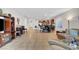 A well-lit living room that flows into an open kitchen and dining area at 2613 Velodrome Ct, Henderson, NV 89044