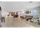Spacious open-plan living area with tile floors, seamlessly flowing into the kitchen at 2613 Velodrome Ct, Henderson, NV 89044