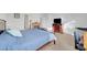 Cozy main bedroom with a fireplace, comfortable bedding, and a dedicated workspace at 2613 Velodrome Ct, Henderson, NV 89044