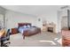 Inviting main bedroom with a fireplace, desk area, and ample natural light at 2613 Velodrome Ct, Henderson, NV 89044