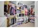 Organized walk-in closet with shelves, hanging racks, and storage boxes for efficient space utilization at 2613 Velodrome Ct, Henderson, NV 89044