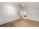 Large bedroom with a fan, neutral walls and carpet flooring, with a bathroom nearby at 2832 Cape Hope Way, Las Vegas, NV 89121