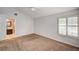 This bedroom has a fan, is painted a light gray, and has a door to the bathroom at 2832 Cape Hope Way, Las Vegas, NV 89121