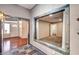 Hallway featuring decorative tile, archway, and entry to the home's carpeted office at 2832 Cape Hope Way, Las Vegas, NV 89121