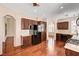 Spacious kitchen featuring dark wood cabinets, granite countertops, and modern appliances at 2832 Cape Hope Way, Las Vegas, NV 89121