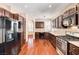 Bright kitchen boasting dark wood cabinets, stainless steel appliances, and a spacious layout at 2832 Cape Hope Way, Las Vegas, NV 89121