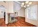 Bright living room featuring a fireplace, hardwood floors, and plantation shutters at 2832 Cape Hope Way, Las Vegas, NV 89121