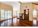 Inviting living room with fireplace, hardwood floors, plantation shutters, and high ceilings at 2832 Cape Hope Way, Las Vegas, NV 89121