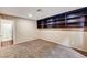Comfortable office with carpeted floors and built-in dark wood shelving at 2832 Cape Hope Way, Las Vegas, NV 89121