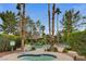 Relaxing pool and spa area surrounded by lush landscaping and mature palm trees create a private oasis at 2832 Cape Hope Way, Las Vegas, NV 89121