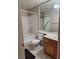 Bright bathroom with a large mirror, shower over tub, and tile flooring at 2974 Juniper Hills Blvd # 104, Las Vegas, NV 89142