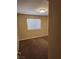 Bedroom with a window for natural light, neutral walls, and tan carpet at 2974 Juniper Hills Blvd # 104, Las Vegas, NV 89142