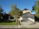 Charming home featuring a spacious driveway and well-manicured lawn at 3138 White Rose Way, Henderson, NV 89014