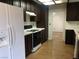 Kitchen featuring wood cabinets and laminate countertops, black appliances at 3138 White Rose Way, Henderson, NV 89014