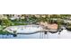 Beautiful aerial view of the community pool, lush landscaping, and nearby lake at 3150 Soft Breezes Dr # 1050, Las Vegas, NV 89128