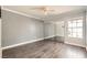 Bedroom with wood-look flooring and large mirrored closet doors at 3150 Soft Breezes Dr # 1050, Las Vegas, NV 89128