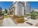 View of the condo building exterior showcasing manicured landscaping and inviting walkways at 3150 Soft Breezes Dr # 1050, Las Vegas, NV 89128