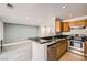 The kitchen opens to the living room, featuring modern appliances and a breakfast bar at 3150 Soft Breezes Dr # 1050, Las Vegas, NV 89128