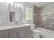 Stylishly remodeled bathroom features a marble countertop, new vanity, new fixtures, and a shower-tub combo at 326 Fuente Dr, Henderson, NV 89014