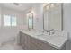 Clean bathroom with a double sink vanity and bright mirrors at 326 Fuente Dr, Henderson, NV 89014