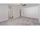 A bright bedroom features neutral carpet, a ceiling fan, and a closet at 326 Fuente Dr, Henderson, NV 89014