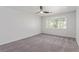 Spacious bedroom with a ceiling fan and a large window for natural light at 326 Fuente Dr, Henderson, NV 89014