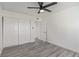 This bedroom features gray wood-look floors and a double door closet at 326 Fuente Dr, Henderson, NV 89014